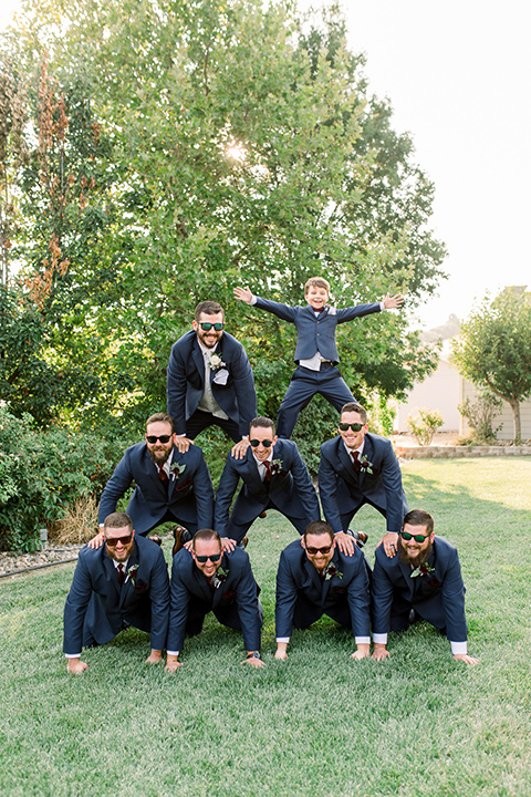 Burgundy-and-Blue-wedding-groomsmen-in-dark-blue-suits