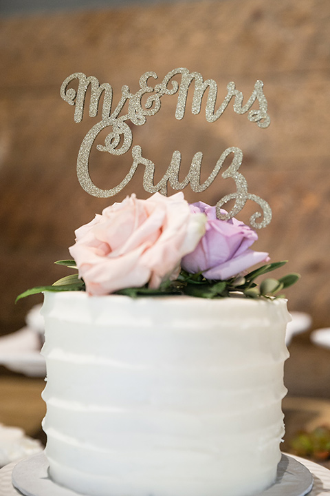 Garden-Wedding-cake-with-white-frosting-and-pink-flower-design