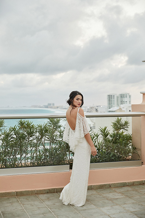 Grand-Firesta-Americana-Coral-Beach-bride-alone-bride-wearing-a-fitted-gown-with-lace