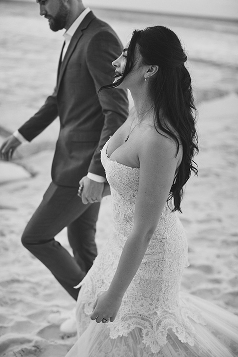 Grand-Firesta-Americana-Coral-Beach-bride-and-groom-walking-on-the-beach