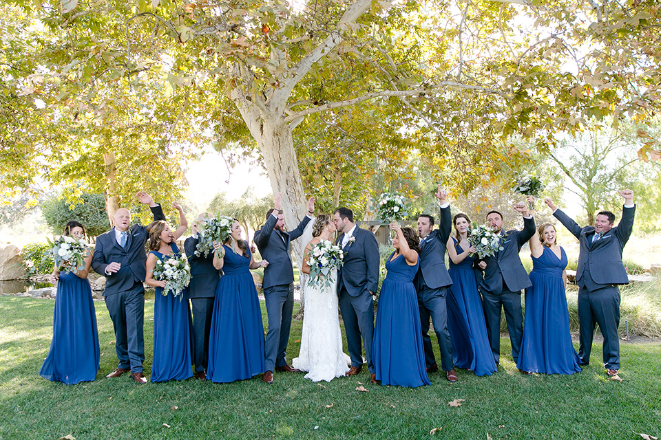 gallaway-downs-wedding-bridalparty-walking-bridesmaids-in-royal-blue-gowns-groomsmen-in-navy-blue-suits-bride-in-a-lace-a-line-gown-and-groom-in-a-navy-blue-suit-with-a-white-long-tie