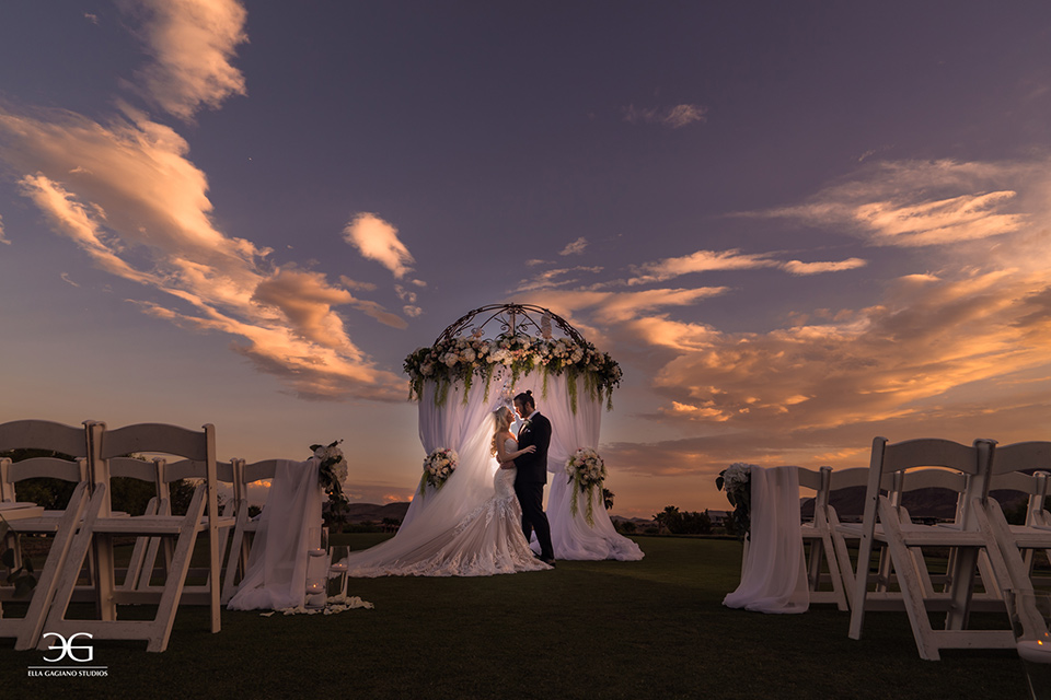 Bears-Best-Venue-Wedding-Shoot-bride-and-groom-at-ceremony-space-with-the-bride-wearing-a-long-lace-strapless-gown-and-the-groom-wearing-a-black-tuxedo-and-black-accessories