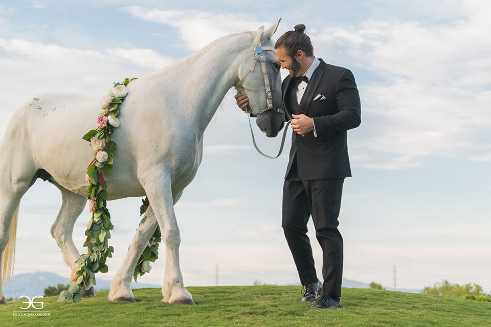 Bears-Best-Venue-Wedding-Shoot-groom-with-horse-groom-wearing-a-black-tuxedo-and-black-accessories