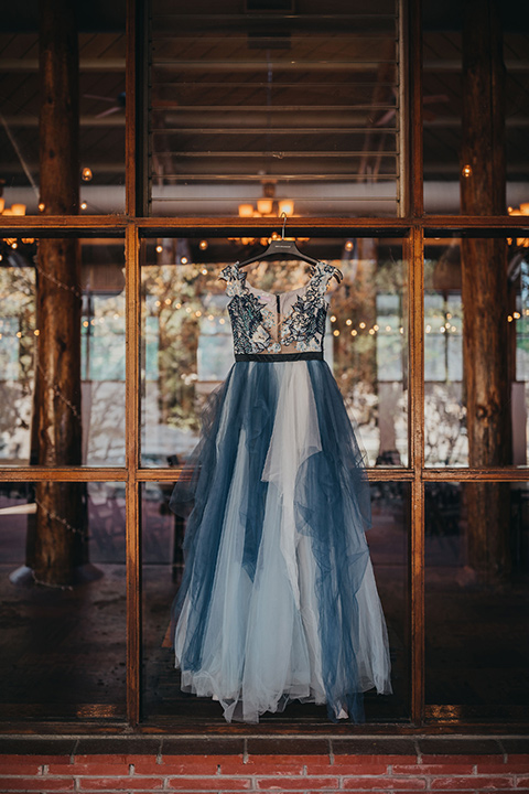 Big-Bear-Elopement-Shoot-gown-with-different-shades-of-blue-tulle-and-an-illusion-neckline-and-floral-design