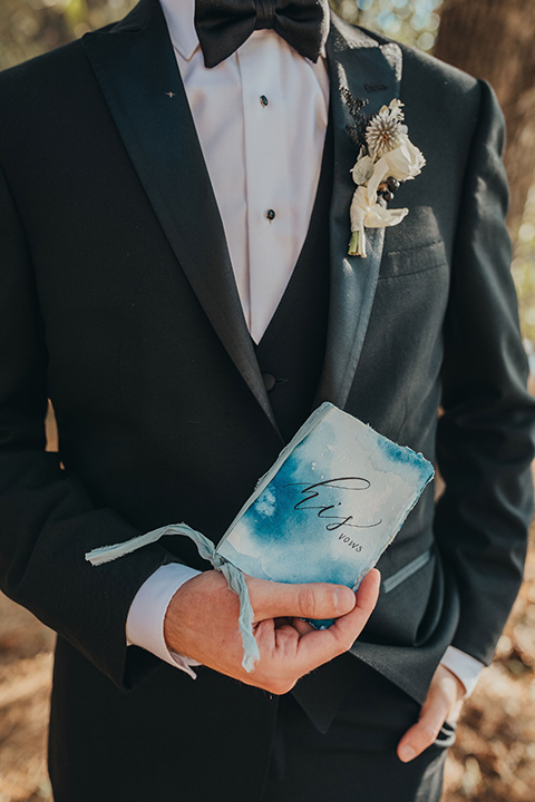 Big-Bear-Elopement-Shoot-groom-holding-vows