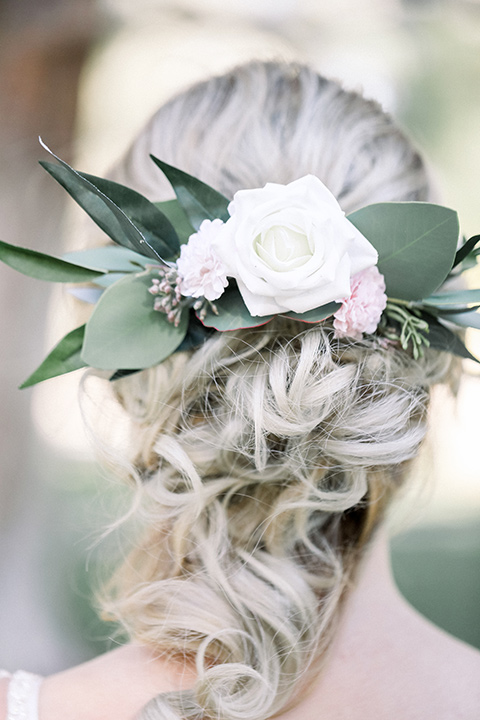 Bridal hair in a loose braid with flowers in it