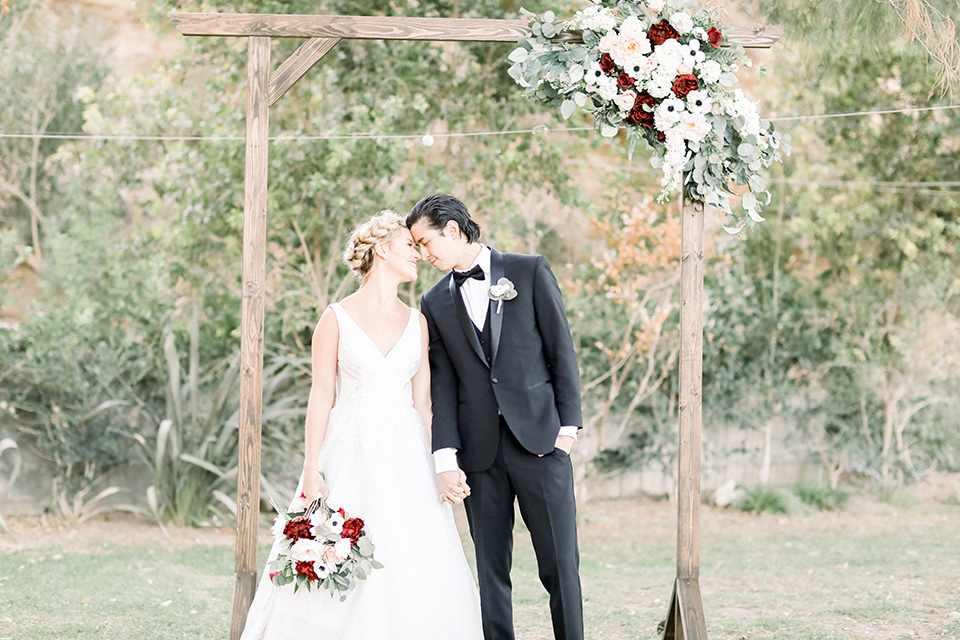 bride and groom touch heads during wedding ceremony at Blomgren Ranch