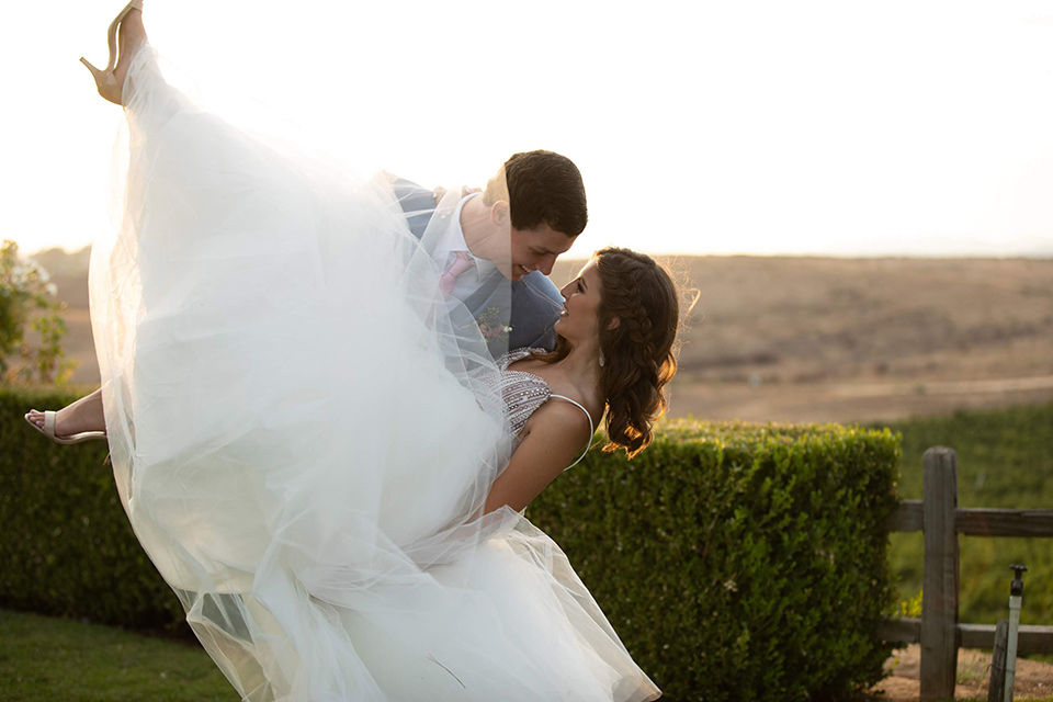 Callaway-Styled-Shoot-groom-dipping-bride-in-a-light-blue-suit