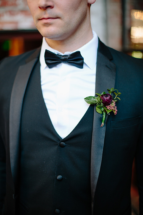 Carondelet-House-wedding-groom-attire-close-up-in-a-traditional-black-tuxedo-with-a-black-bow-tie