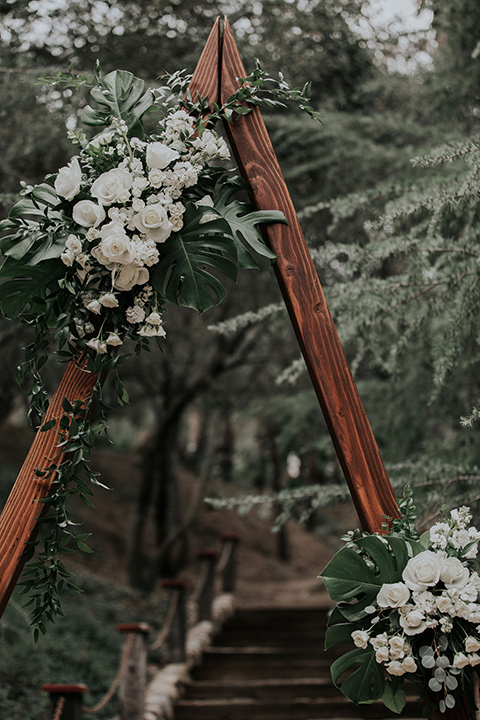 rancho-las-lomas-real-wedding-ceremony-arch-in-a-deep-wood-with-a-geometric-triangle-shape