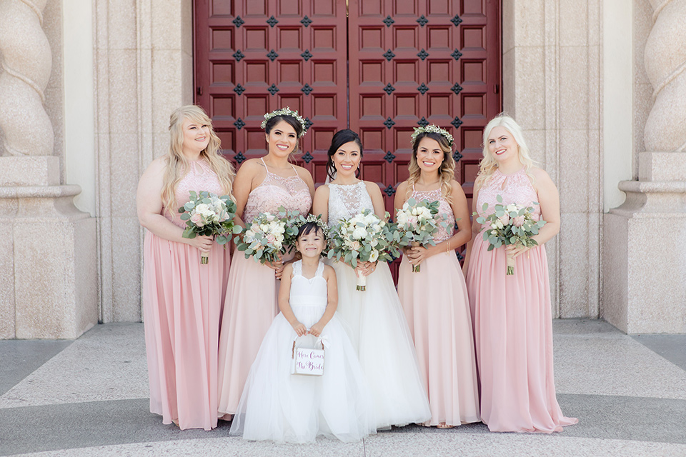 kellogg-house-pomona-wedding-bridesmaids-the-bridesmaids-are-in-pink-toned-gowns-bride-in-a-mermaid-style-gown-with-a-high-neckline