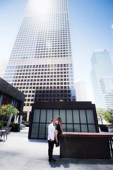 City-club-shoot-bride-and-groom-with-skyscrapers-in-background-bride-in-a-white-ballgown-with-a-sweetheart-neckline-groom-in-a-white-jacket-with-black-pants