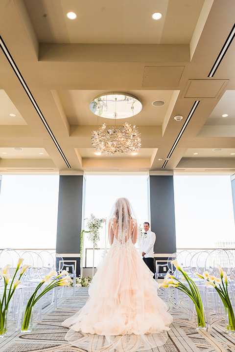 City-club-shoot-bride-facing-windows-in-a-white-ballgown-with-a-sweetheart-neckline