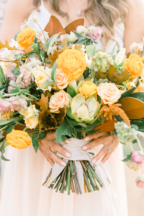 Claudia+Johns-meadow-elopement-bridal-flowers-in-deep-yellows-and-orange-tones