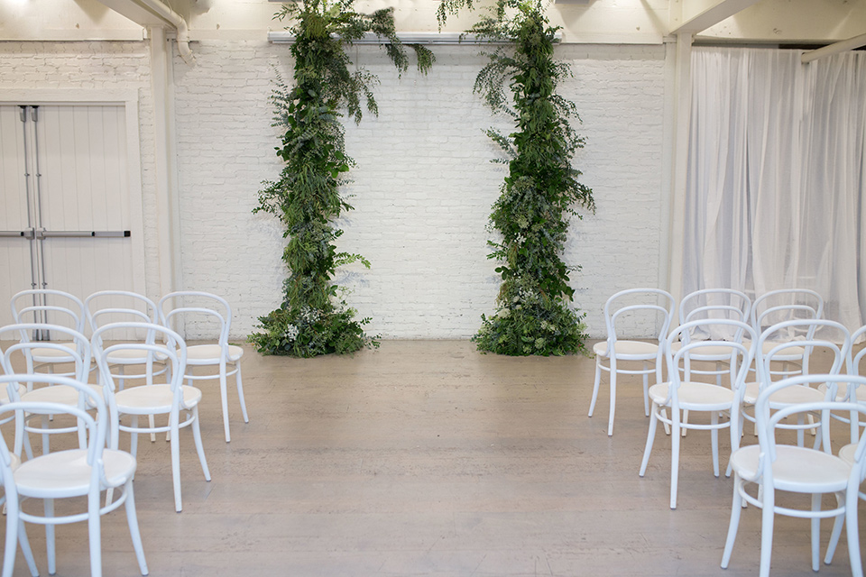 Cooks-Chapel-Shoot-ceremony-set-up-with-draping-green-garlands-and-white-chairs