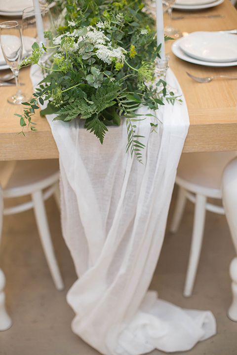 ”Cooks-Chapel-Shoot-linens-in-soft-flowing-white-with-green-décor-elements"