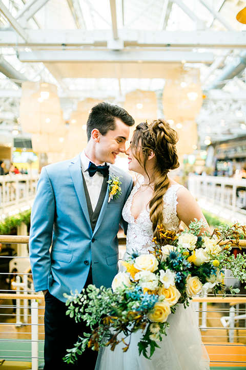  Wedding bride and groom touching heads at the anaheim packing house and hugging