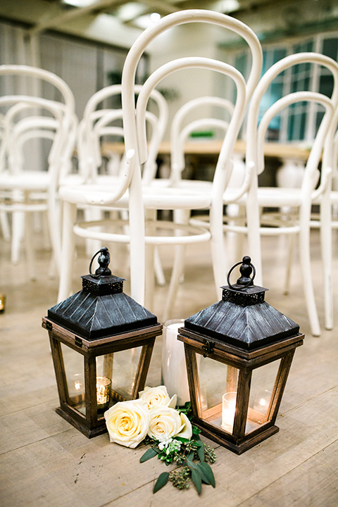 Cooks-Chapel-Wedding-ceremony-décor-with-black-iron-lanters-and-white-metal-chairs