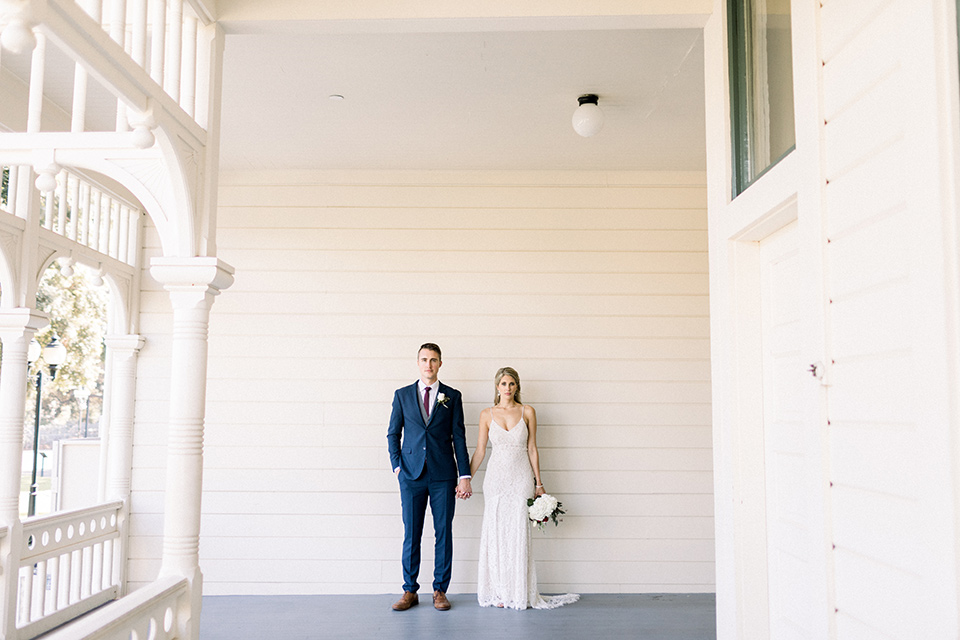 red-barn-wedding-bride-and-groom-on-porch