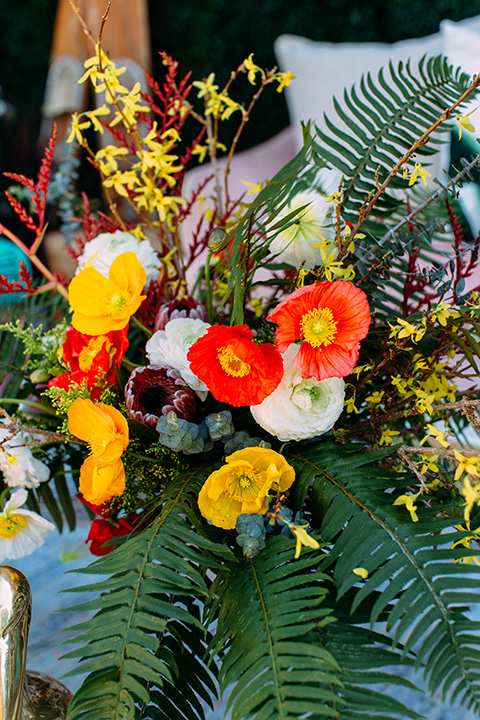 red and yellow wedding floral decorations outside