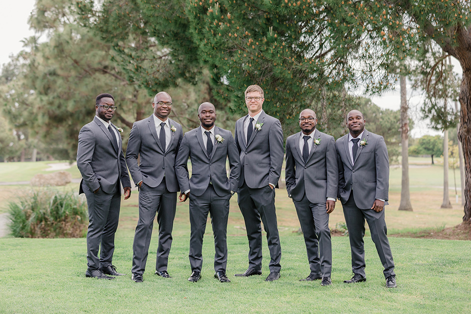 Los-Verdes-Golf-Course-Wedding-groomsmen-and-groom-in-a-charcoal-tuxedo-with-a-black-tie
