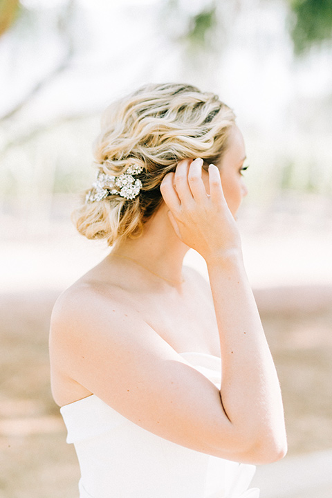  bride in a white strapless ballgown with her hair in a bun 