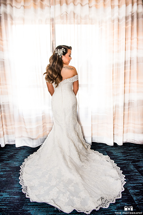 San-Diego-Wedding-bride-in-a-white-lace-gown-with-an-off-the-shoulder-neckline-groom-is-in-a-black-tuxedo-with-a-black-bow-tie