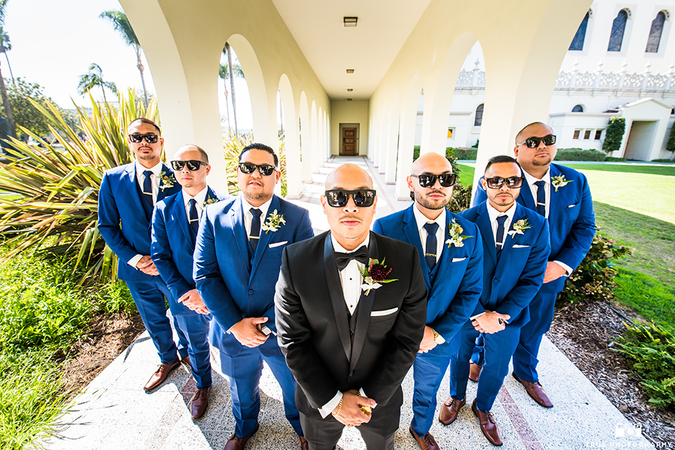 San-Diego-Wedding-groomsmen-in-cobalt-suits-and-the-groom-is-in-a-black-tuxedo-with-a-black-bow-tie