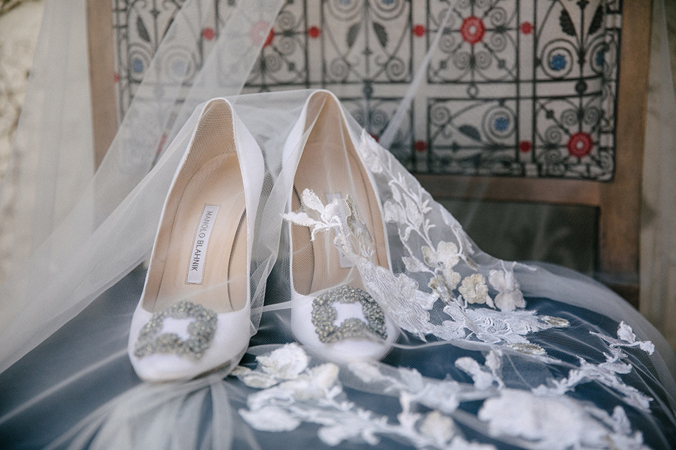 White bridal shoes with a silver buckle detail