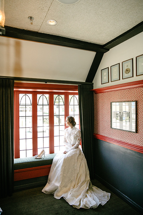 bride in a white lace gown with cap sleeves