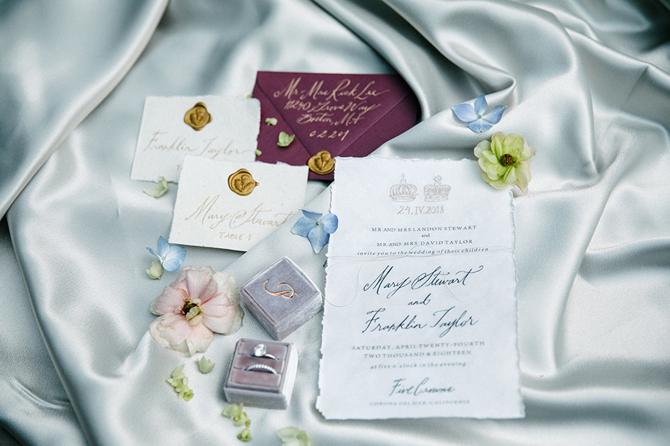 white and floral embellished invitations