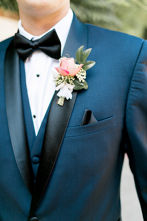 franciscan-gardens-wedding-close-up-on-groom-look-groom-in-a-dark-blue-tuxedo-with-a-black-shawl-lapel-and-black-bow-tie