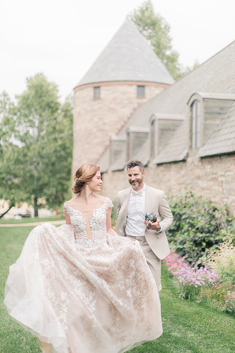 bride and groom running in the garden