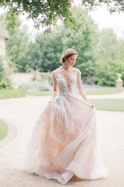 bride in a champagne ballgown with a cap sleeve and lace detailing