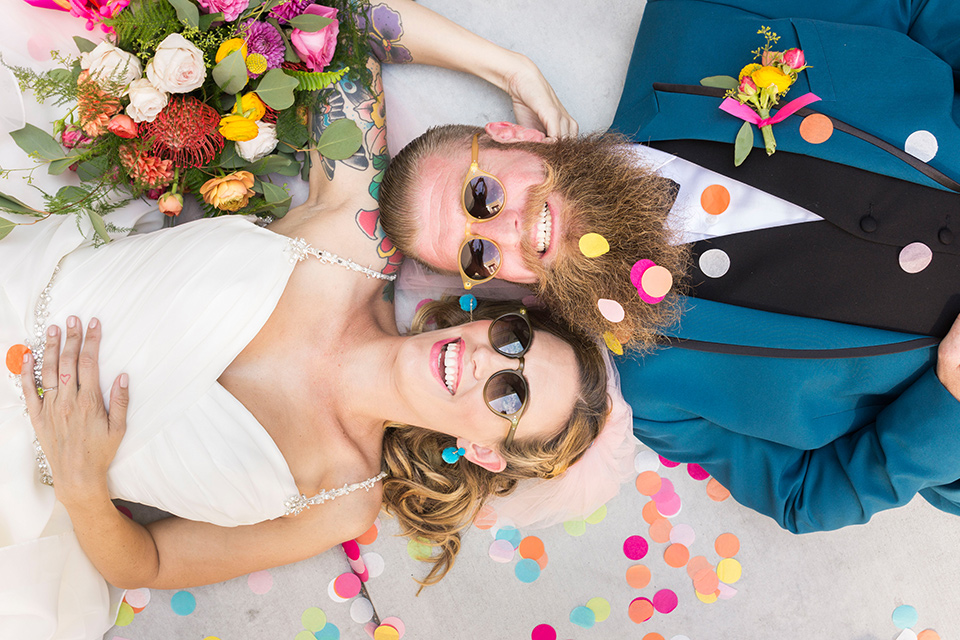 rock and roll bride and groom in las vegas with a teal tuxedo and sunglasses