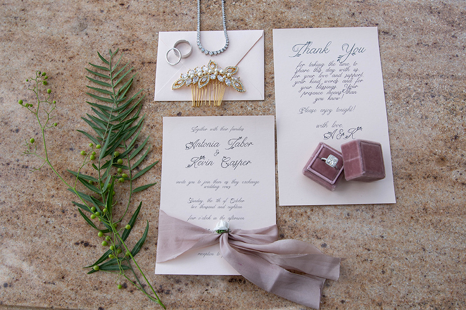 white invitations with a purple and pink design