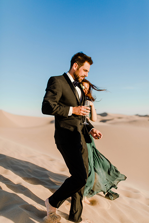 Glamis-Engagement-Shoot-bride-and-groom-walking-down-dunes-close-up