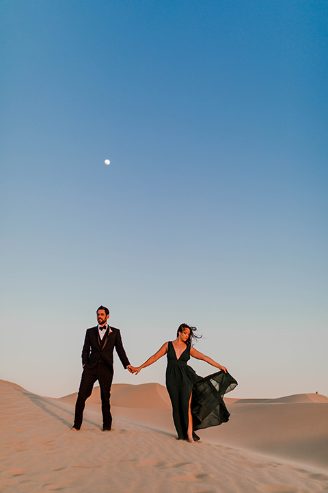 Glamis-Engagement-Shoot-bride-and-groom-with-moon-behind-them