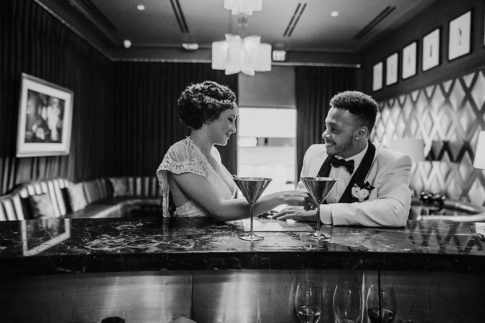 Art deco and roaring twenties inspired bride and groom at a bar