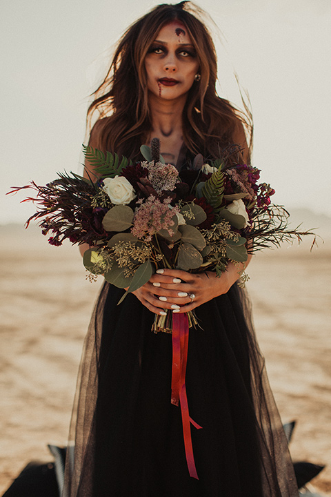 Halloween shoot with the bride in a black and burgundy tulle gown with a black veil