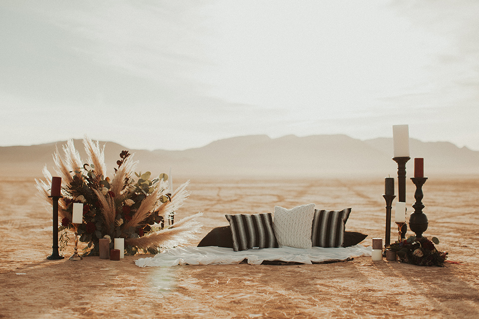 Halloween shoot with carpets on the ground with pampas grass and candles