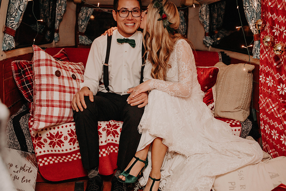 Highway-West-Vacations-bride-and-groom-in-bus-bride-in-a-lace-bohemian-dress-with-sleeves-and-floral-crown-groom-in-a-black-tuxedo