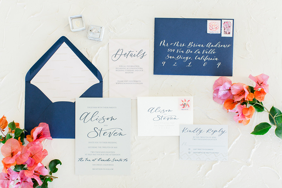 white and navy invitations with pink florals