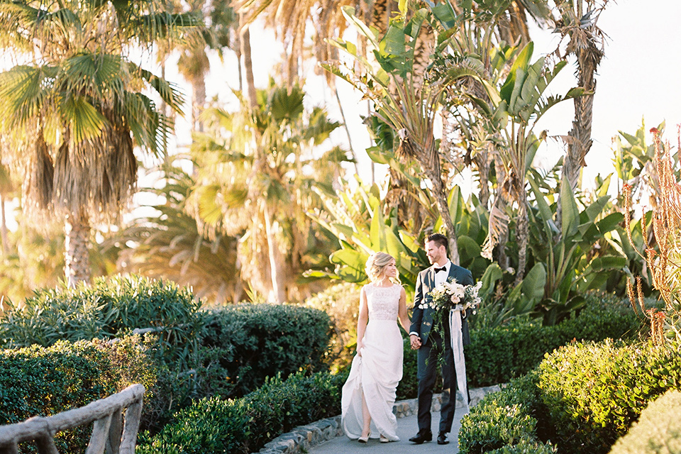 The-Inn-at-Laguna-Beach-bride-and-groom-walking-on-the-grounds-on-the-venue