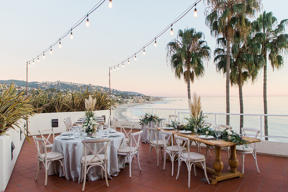 The-Inn-at-Laguna-Beach-reception-with-wooden-tables-and-chairs-with-string-lights