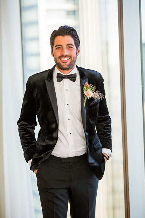 Intercontinental-elopement-shoot-groom-in-black-velvet-looking-at-camera