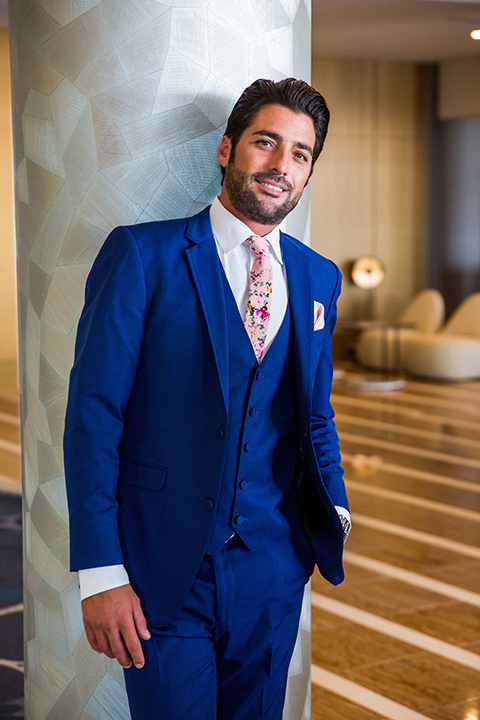 Intercontinental-elopement-shoot-groom-in-a-cobalt-blue-suit-with-pink-floral-tie