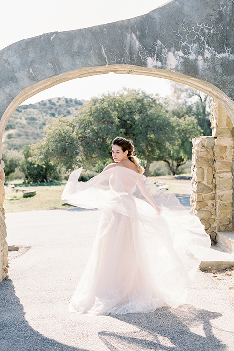 italian-style-wedding-bride-twirling-in-a-flowing-gown-with-straps