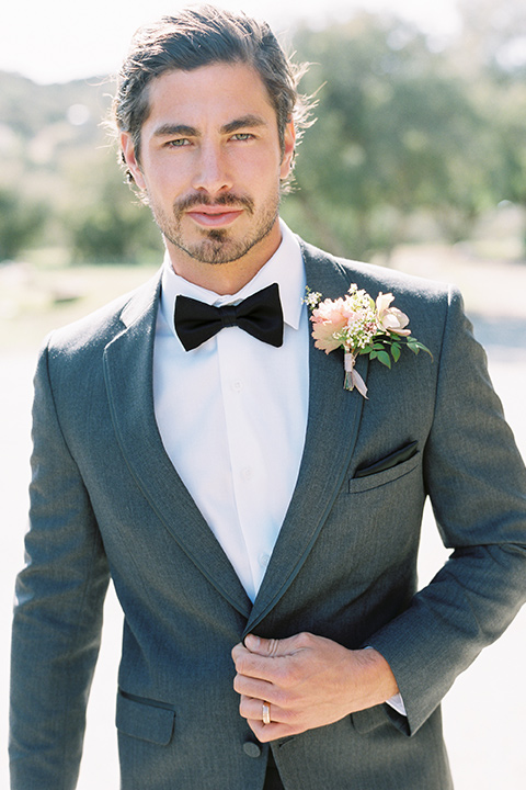 italian-style-wedding-groom-looking-at-camera-in-a-grey-tuxedo