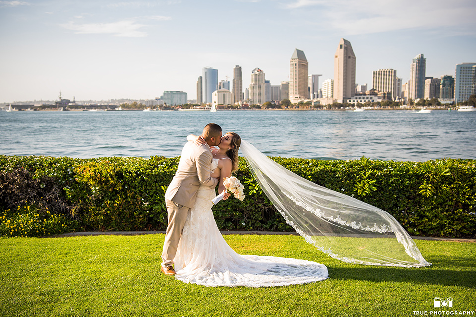 groom dipping the bride after a wedding in San Diego